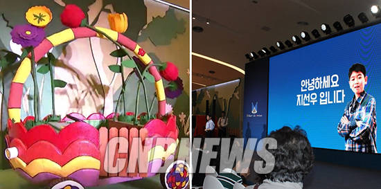 베일을 벗은 ‘꽃바구니 자동차’(왼쪽)와 ‘옐로 돌핀카’를 소개한 지선우 어린이. (사진=정의식 기자)